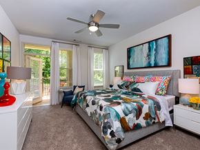 Charlotte apartment for rent - Bedroom with private patio access at Sycamore at Tyvola, Charlotte, North Carolina
