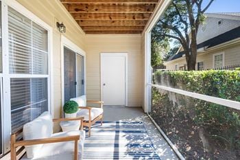 Patio two chairs and a white door