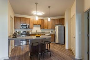 Pooler apartment for rent - a kitchen with stainless steel appliances and a granite counter top at Two Addison Place, Georgia