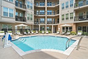Davidson apartment for rent - A large swimming pool in front of apartment buildings at The Linden Apartments, Davidson