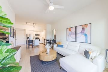 Miami Lakes apartment for rent - A living room with a white couch and a coffee table.
