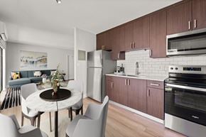Miami Lakes apartment for rent - A modern kitchen with a dining table and chairs.