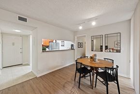 Miami Lakes apartment for rent - a dining room with a table and chairs and a kitchen