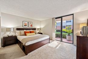 Miami Lakes apartment for rent - a bedroom with a bed and a sliding glass door