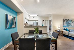 Miami Lakes apartment for rent - a dining room with a glass table and chairs