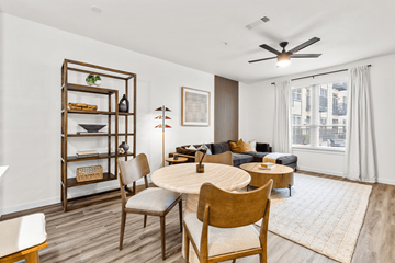 San Antonio apartment for rent - A living room with a round table and chairs.