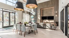 Katy apartment for rent - a dining room with a table and chairs and a kitchen with glass doors
