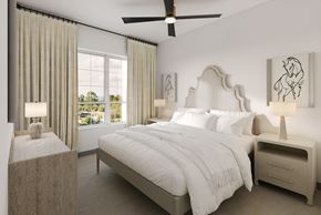 San Antonio apartment for rent - A bedroom with a large bed, two nightstands, and a ceiling fan.