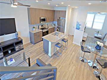 Scottsdale townhouse for rent - a view of a kitchen and living room with a table and chairs
