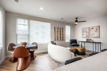 Lakewood apartment for rent - A living room with a brown chair and a white sofa.