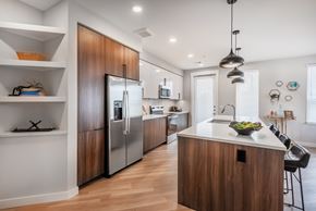Lakewood apartment for rent - A modern kitchen with wooden cabinets and stainless steel appliances.