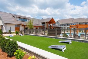 Spring Hill apartment for rent - A modern building with a pool in the backyard.