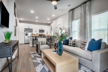 Schertz townhouse for rent - A modern living room with a grey couch and a wooden coffee table.