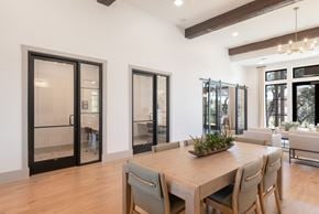 Boerne townhouse for rent - A dining room with a wooden table and chairs.