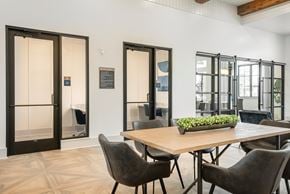 Fort Worth townhouse for rent - A dining room with a table and chairs and a glass door.