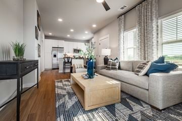 Fort Worth townhouse for rent - A modern living room with a grey couch and a wooden coffee table.