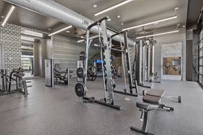 San Antonio apartment for rent - a gym with weights and other exercise equipment in a building