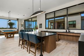 Goodyear apartment for rent - A modern kitchen with a pool table and bar area.
