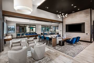 Goodyear apartment for rent - A modern living room with a pool table and a television.
