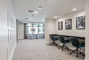 Phoenix apartment for rent - A conference room with a long table and chairs.