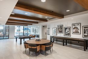 Charlotte apartment for rent - A modern dining room with a round table and chairs.