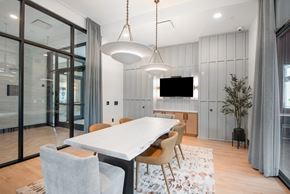 Littleton apartment for rent - A modern dining room with a large table and chairs.
