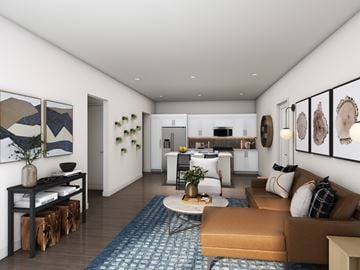 Littleton apartment for rent - A modern living room with a brown sofa and a coffee table.