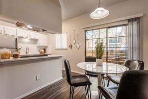 Austin apartment for rent - an open kitchen and dining area with a table and chairs