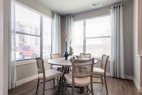 Peoria apartment for rent - A dining room with a table and chairs.