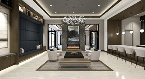 San Antonio apartment for rent - A modern living room with a fireplace and a chandelier.
