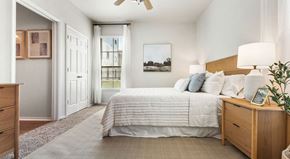 Selma apartment for rent - a bedroom with a bed and a ceiling fan