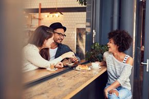 Spring Hill apartment for rent - Three people are sitting at a table in a cafe.