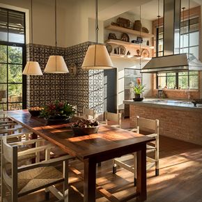 San Antonio apartment for rent - a dining room with a wooden table and chairs and a kitchen