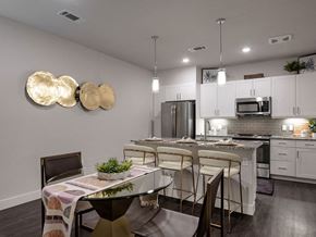 Littleton apartment for rent - an open kitchen and dining room with a table and chairs