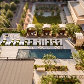 San Antonio apartment for rent - A modern building with a pool in the middle of the courtyard.