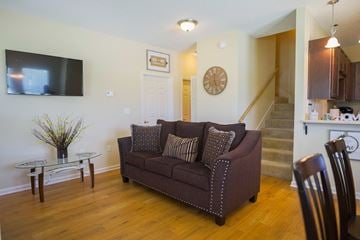 Bay City townhouse for rent - a living room with a couch and a table