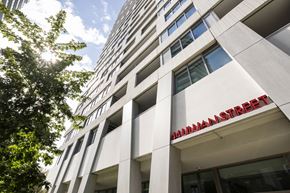 Toronto apartment for rent - A tall building with the word "Manhattan" written on it.