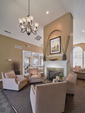 Copley apartment for rent - a living room with couches and chairs and a fireplace