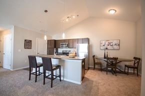 Uniontown apartment for rent - an open kitchen and dining area with a table and chairs