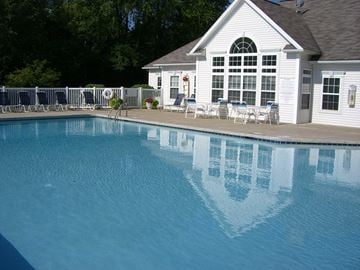 Copley apartment for rent - a large swimming pool in front of a house