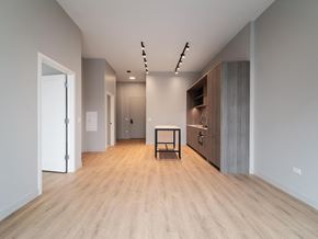 Chicago apartment for rent - a living room with a wooden floor and a wooden table