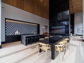Chicago apartment for rent - a dining room with a table and chairs and a tv