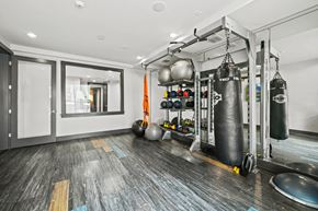 Orlando apartment for rent - A gym with a punching bag hanging from the ceiling.