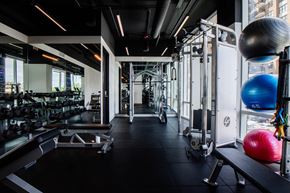 Chicago apartment for rent - A gym with a variety of equipment including weights and exercise balls.