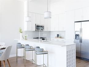 Nashville apartment for rent - Apartments for Rent The Gulch Nashville, TN - 1200 Broadway - Tile Backsplash in Kitchen with Breakfast Bar, Quartz Countertops, Shaker-Style Cabinetry, and Stainless Steel Appliances.