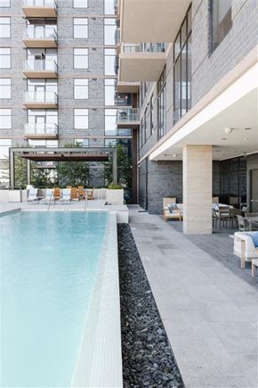 Nashville apartment for rent - a swimming pool in front of an apartment building