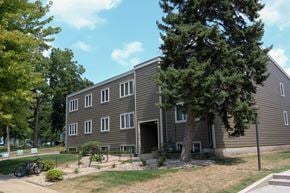 Sioux Falls apartment for rent - a large building with a tree in front of it