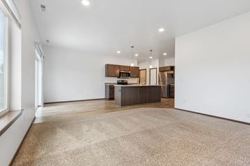 Sioux Falls apartment for rent - A spacious kitchen and living room with a large rug on the floor.