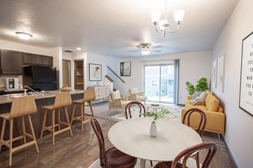 Sioux Falls townhouse for rent - a living room and dining room with a table and chairs