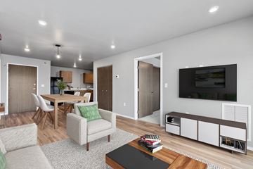 Rapid City apartment for rent - a living room and dining room with a television